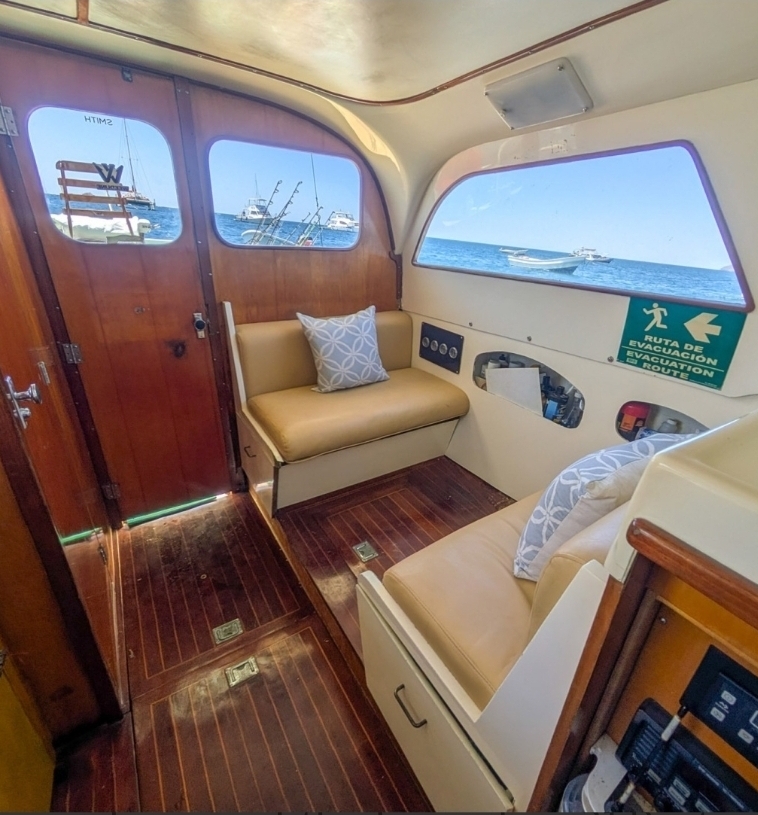 Air-conditioned cabin with leather seating and teak floor